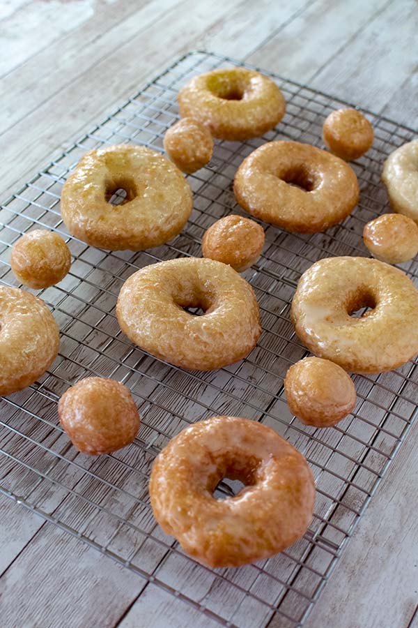 Dairy Free Doughnuts Glazed and doughnut holes on a cooling rack