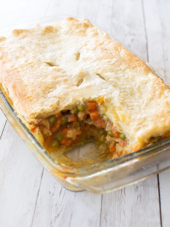 Easy Dairy-Free Chicken Pot Pie Casserole in a clear glass baking dish on a white wood table